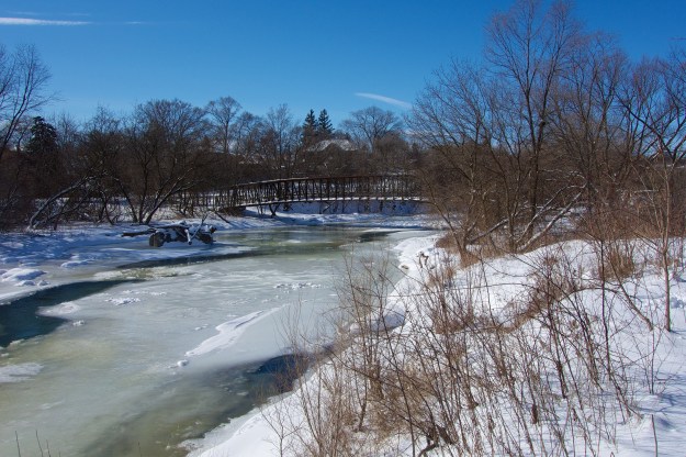 The old bridge abutment is in the left foreground.