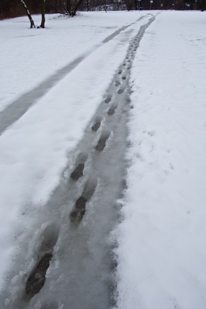 A human has walked on tire tracks.