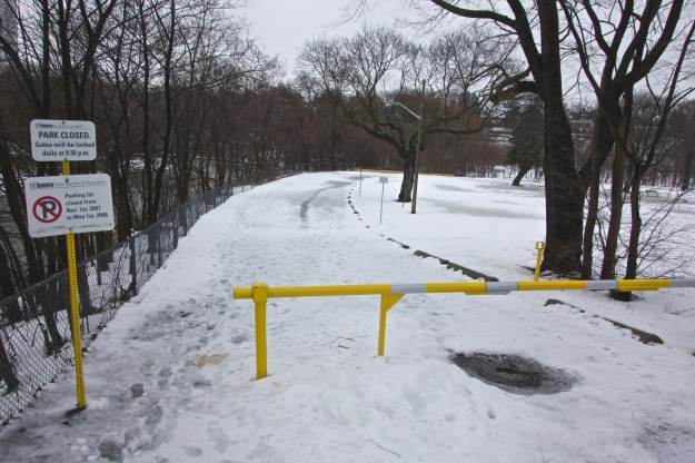 Inauspicious entrance to the park and a sign that has outlived it's specific timeframe.