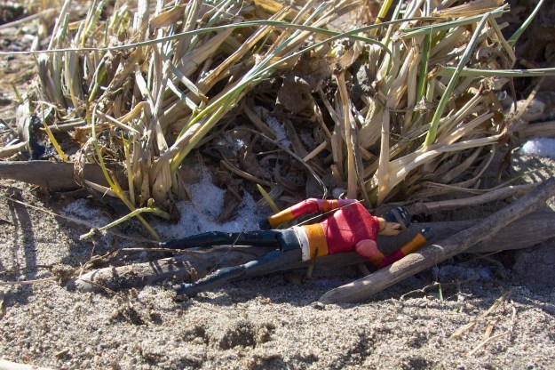 A toy figure seems to have thrown himself down in despair.