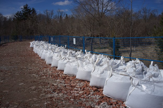 Bags of gravel stored by the staging area entrance.