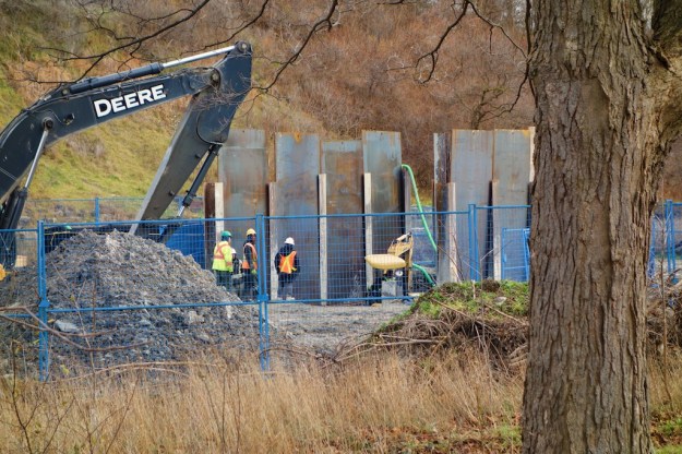 Workers access the main sewer in preparation for re-lining.